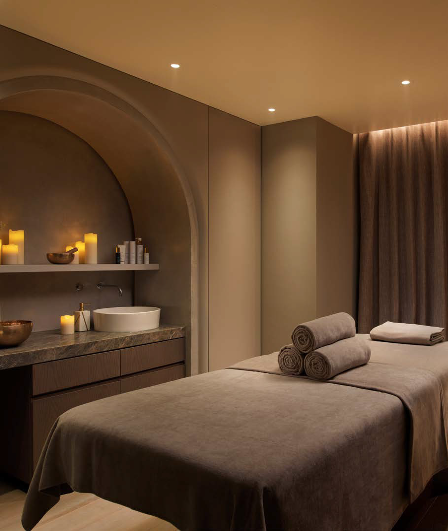 A candle-lit spa treatment room