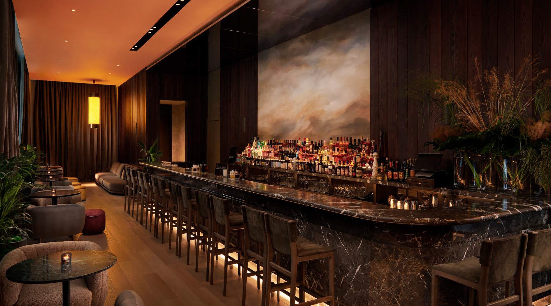 The residents’ bar at One Bishopsgate Plaza, lit warmly at dusk
