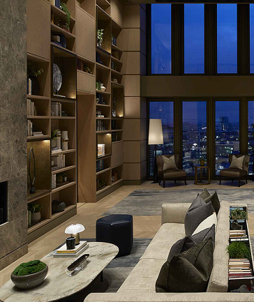 The double-height residents’ library with floor-to-ceiling bookshelves