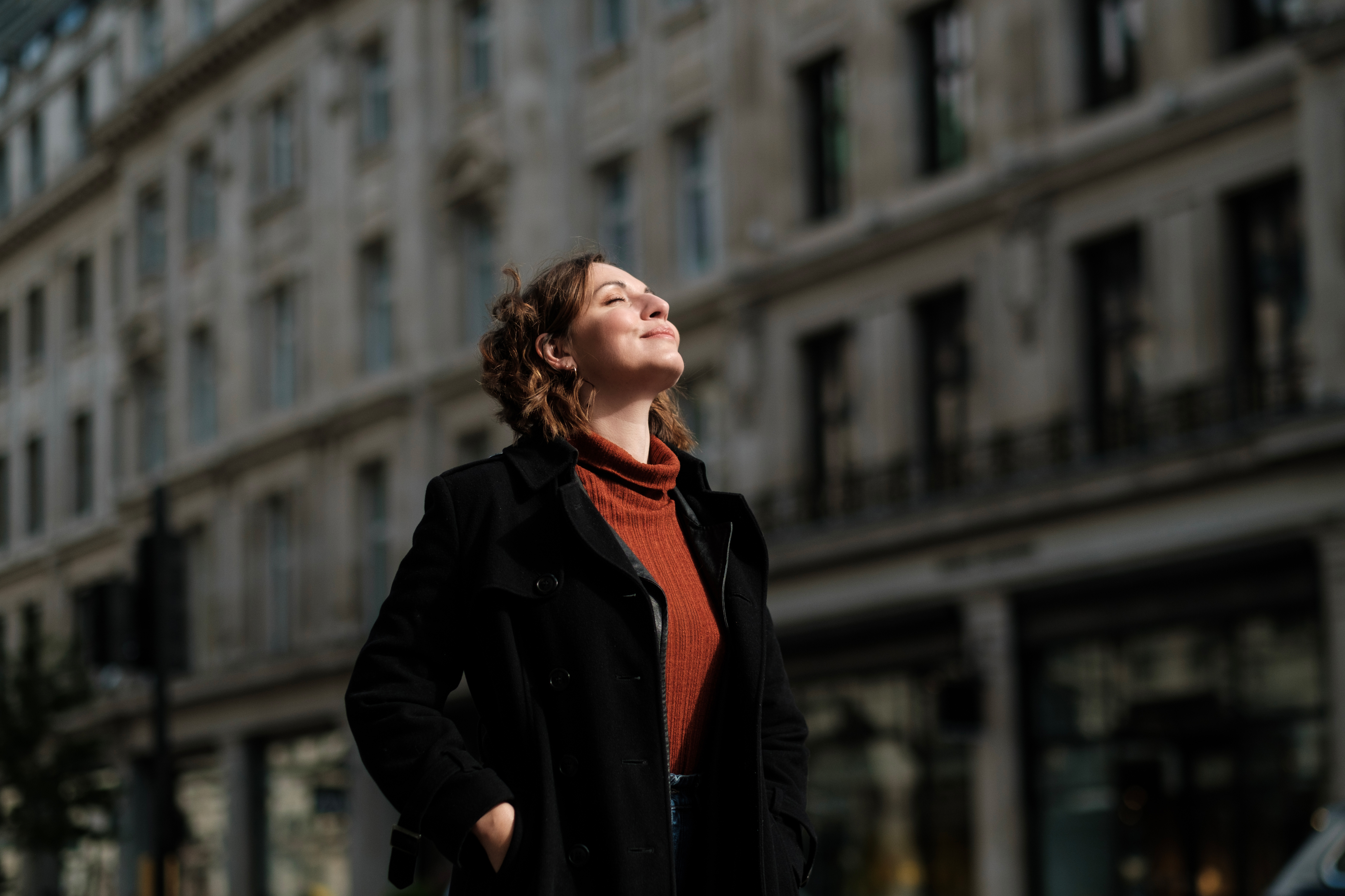 A resident enjoying the sun on a City street